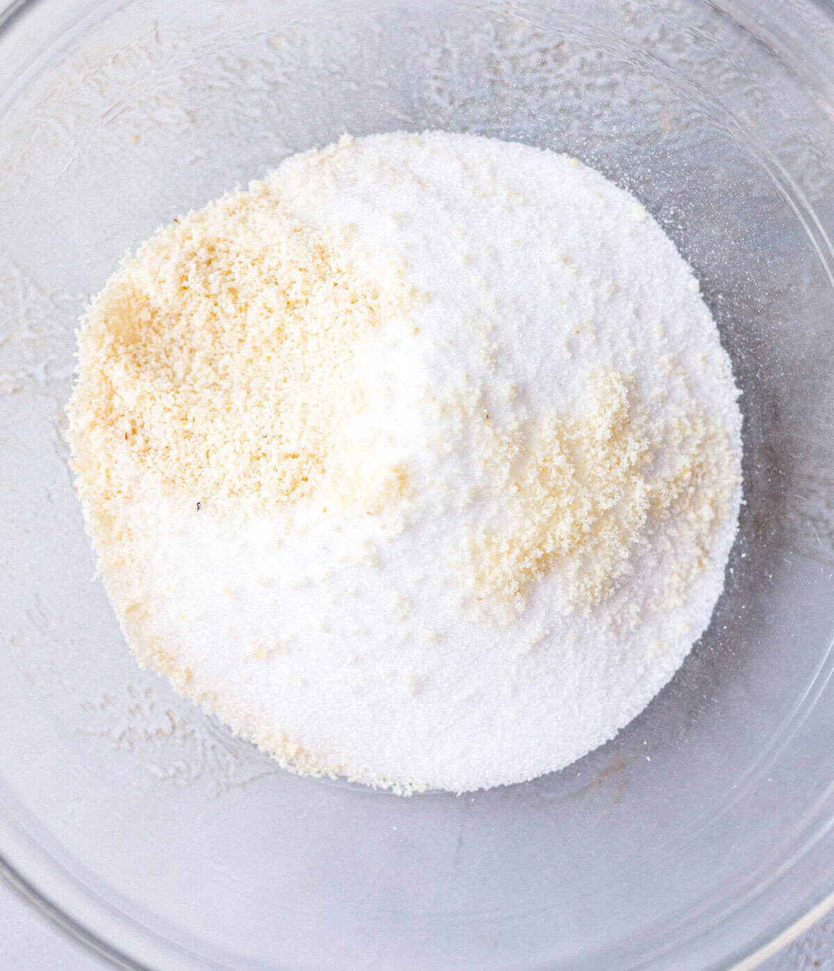 Almond flour and low-carb sweetener in a glass bowl for sugar-free cookies