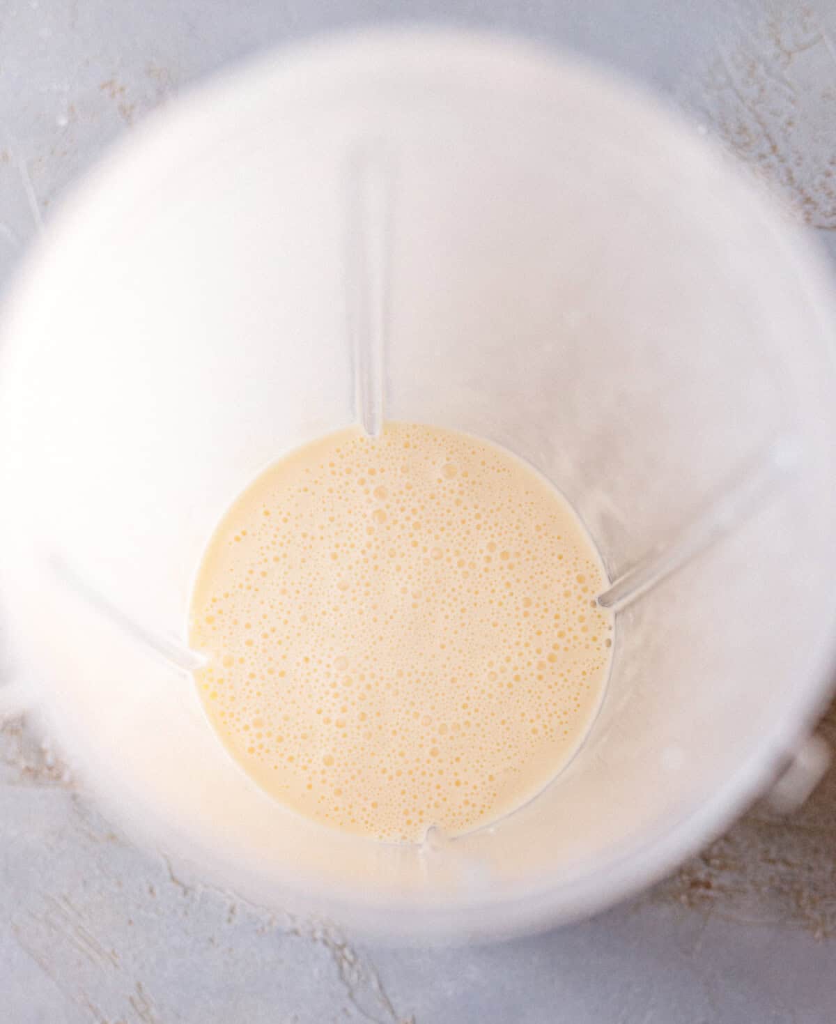 Smooth blended cottage cheese and egg mixture in a blender jar