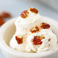 Creamy homemade butter pecan ice cream served in a bowl with buttery toasted pecans.