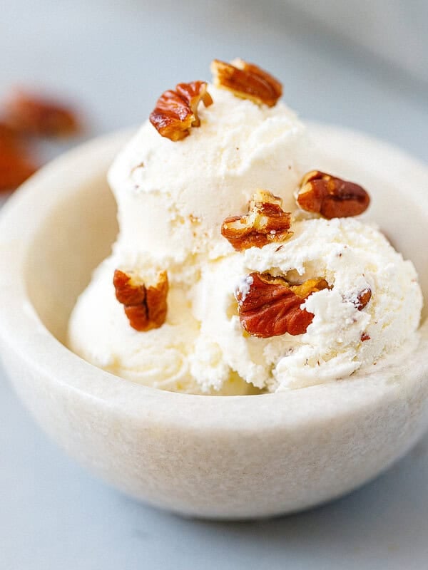 Creamy homemade butter pecan ice cream served in a bowl with buttery toasted pecans.