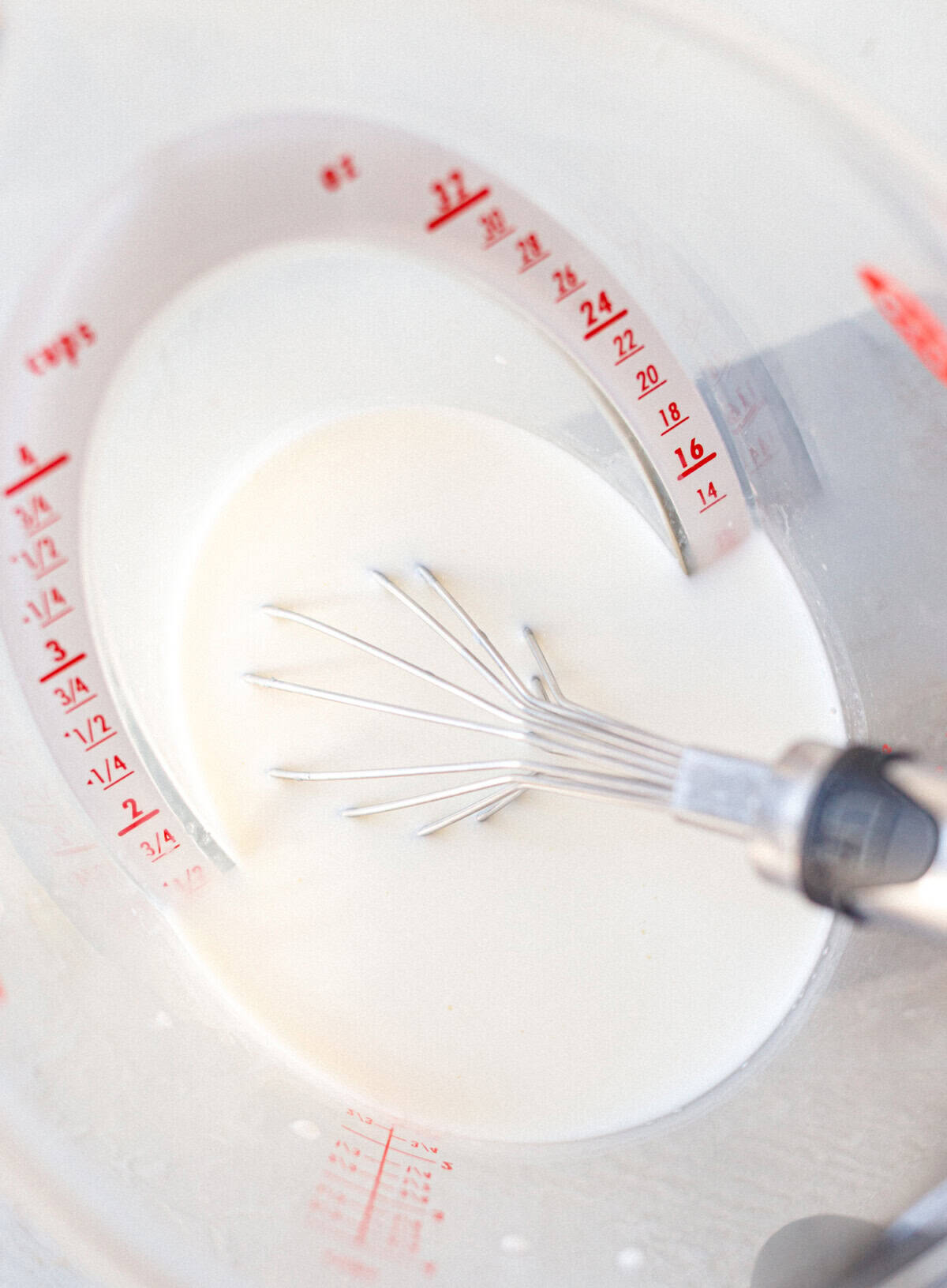Cream mixture whisked for keto butter pecan ice cream before chilling.